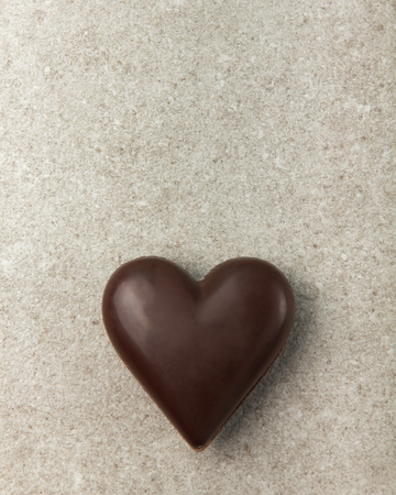 Chocolate heart on a stone background. Background for Valentine's Day.の写真素材