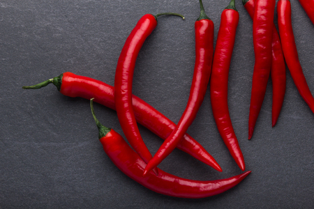 Red hot chili pepper on black backgroundの写真素材