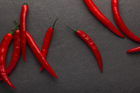 Red hot chili pepper on black background