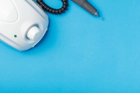Professional manicure tools on blue background.
の写真素材