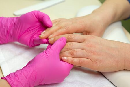 Closeup shot of a woman in a nail salon. Woman getting nail manicure.
の写真素材