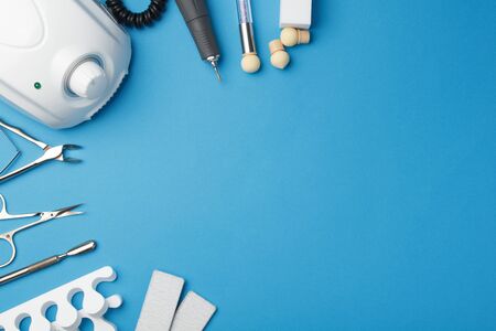 Professional manicure tools on blue background.の写真素材