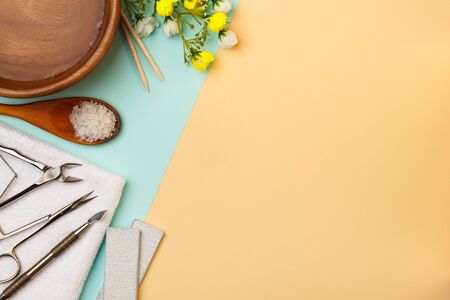 Professional manicure tools on blue and beige background.
の写真素材