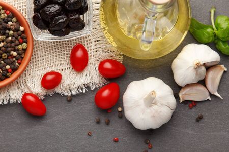 Pasta ingredients. Ingredients for cooking Italian pasta - spaghetti, tomatoes, basil, oil and garlic. Italian food. Top view.
の写真素材