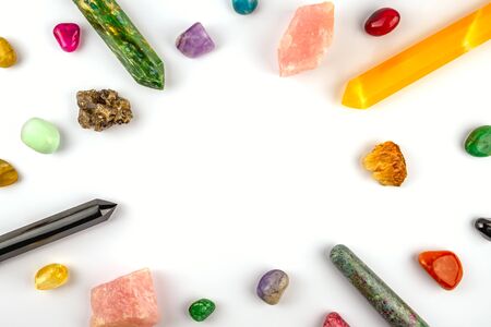 Natural gem geological crystals and stones on white background with free copy space in the middle, flatlayの写真素材