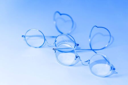 Couple of old fashioned glasses, blue toned pictureの写真素材
