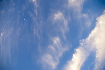 Beautiful blue sky with clouds and the moon, backgroundの写真素材