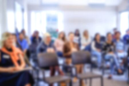Blurred front view background classroom. High school or undergraduate student sitting on lecture chairs listening to speaker. Education conceptの写真素材