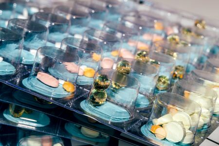 Pills in blisters for every day of the week for the morning, day, night time. Medications for patients in a hospital.の写真素材