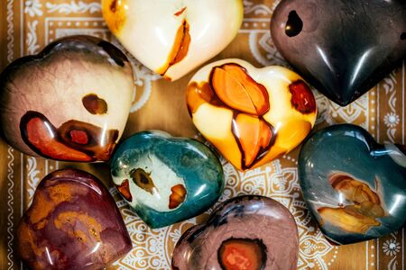 Various colorfull heart shaped stones minerals gems. Natural background.の写真素材