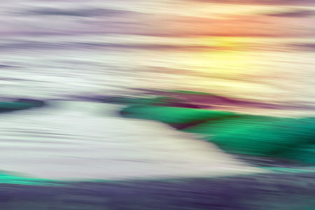 Motion blur abstract water colorful background. Green, purple and yellowの写真素材