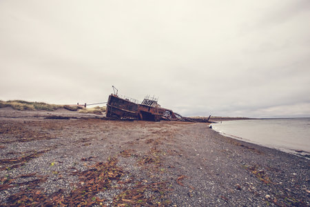 Shipwreck called Amadeo on the  coast of Magellan Strait, rusty warship wreck, Tierra Del Fuego, Chileの写真素材