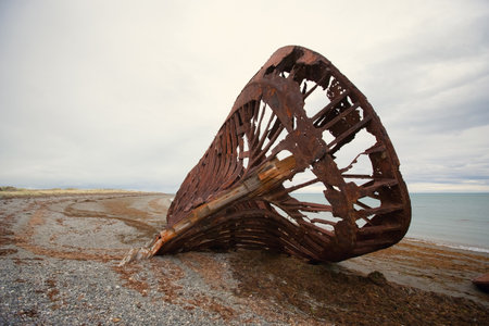 Skeleton of Shipwreck called Ambassador on the  coast of Magellan Strait, rusty warship wreck, Tierra Del Fuego, Chileの写真素材