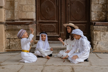 Saudi Arabian kids playing outside the house in Jeddah old town Saudi Srabia