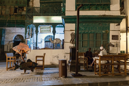Historical house in the old town of Jeddad with wooden windows and doors at evening lights Saudi Arabiaのeditorial素材