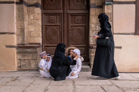 Saudi Arabian kids playing outside the house in Jeddah old town Saudi Srabiaのeditorial素材