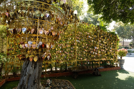 Messages and wishes written on the heart-shaped golden leaves hanging from the bells in Wat Saket...