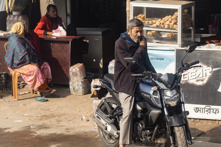 Bangladeshi man on the motorbike in Chittagong Bangladeshのeditorial素材