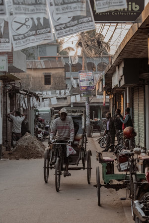 Busy street of Dhaka aerial view local transport rickshaws and people on the street Bangladeshのeditorial素材