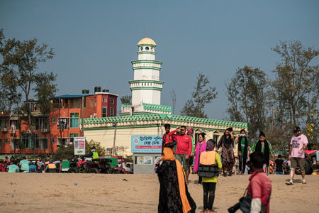 People on the beach of Cox's Bazar in front of the mosque in Bagladeshのeditorial素材