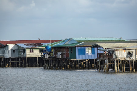 Fishing village houses over the water garbage poor areas in Sabah province in Malaysiaのeditorial素材