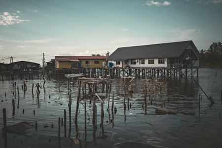 Fishing village houses over the water garbage poor areas in Sabah province in Malaysiaのeditorial素材
