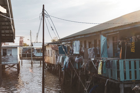 Fishing village houses over the water garbage poor areas in Sabah province in Malaysiaのeditorial素材