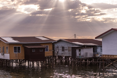 Fishing village houses over the water garbage poor areas in Sabah province in Malaysiaのeditorial素材