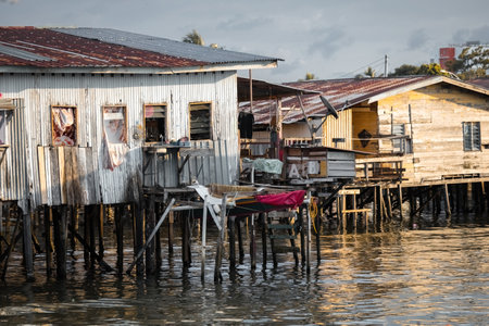 Fishing village houses over the water garbage poor areas in Sabah province in Malaysiaのeditorial素材
