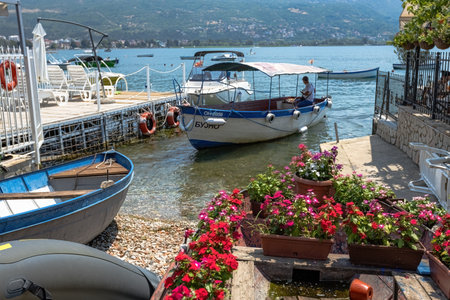 Boats and the old houses at the shore of Ohrid lake North Macedoniaのeditorial素材