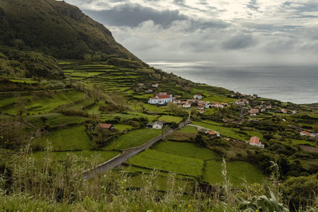 Small village with stone houses and a white church in Flores island, Azores, Portugalの写真素材