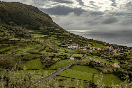 Small village with stone houses anf a white church in Flores island Azores Portugalの写真素材