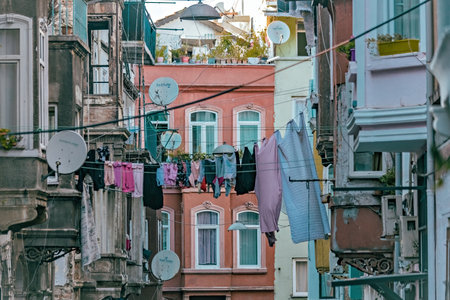 Old houses and laundry hanging between houses at Beyoglu area of Istanbul Turkeyの写真素材