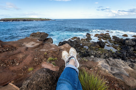 Woman's legs in front of the ocean view