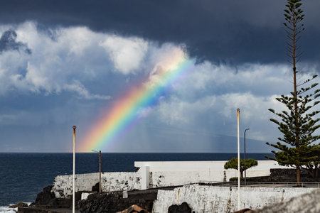 Rainbow over the sea on stormy day Atlantic Ocean Azores islandsの写真素材
