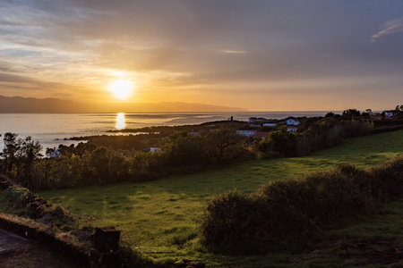 Spectacular sunrise over the sea at Pico island Azores Portugalの写真素材