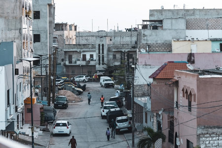Dusty street in the outskirts of Dakar city, Pikine area Senegalのeditorial素材