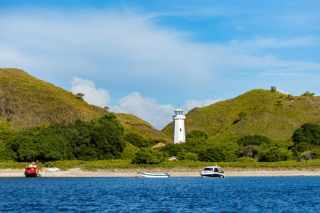 White lighthouse on the Padar island in Komodo national park Indonesiaの写真素材