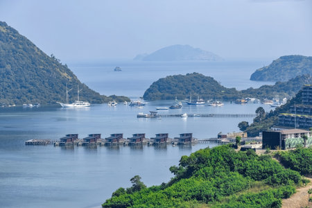 Aerial view of the hills and the bay with huts on the water in Labuan Bajo town Komodo  in Indonesiaの写真素材