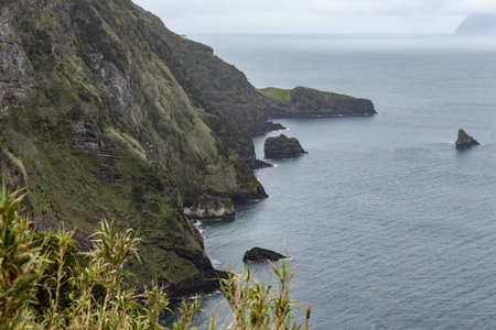 Breathtaking view of the wavy Atlantic ocean from the cliff in Azores islands Portugalの写真素材