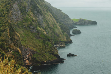 Breathtaking view of the wavy Atlantic ocean from the cliff in Azores islands Portugalの写真素材