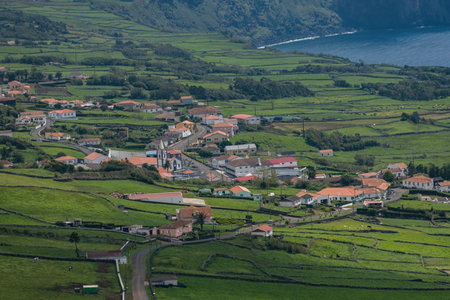 Bright houses on the cliff at Atlantic ocean coast in Azores islands Portugalの写真素材