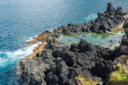 Picturesque coastline cliffs in Azores islands Pico island Portugalの写真素材