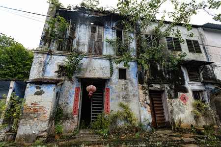 Old abandoned Chinese house details outside view in Papan Heritage village Perak Malaysiaのeditorial素材