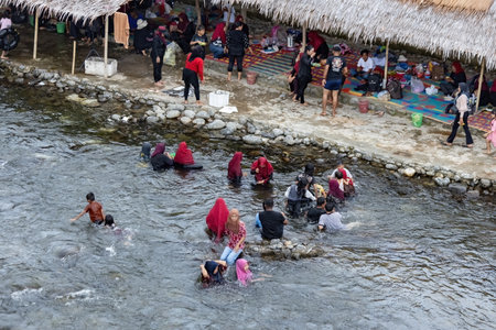 Local people bathing in the river in Bukit Lawang North Sumatra Indonesiaのeditorial素材