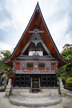 Traditional Toba batak houses with pointed roofs at Samosir island at Toba lake North Sumatra Indonesiaのeditorial素材