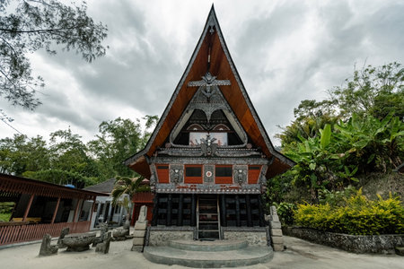 Traditional Toba batak houses with pointed roofs at Samosir island at Toba lake North Sumatra...