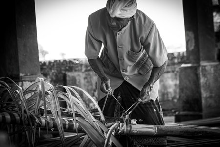 Balinese men preparing decoration for the ceremony in Bali Indonesiaのeditorial素材
