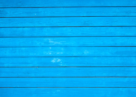 Background, texture - the blue wall of the village house from painted wooden boards - photoの写真素材