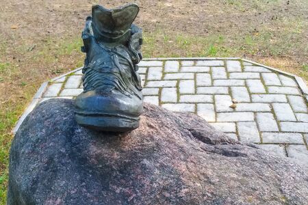 Monument to the boot, the boot stands on a pedestalの写真素材